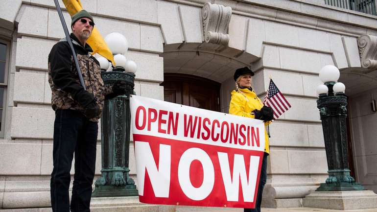 «Карантинні бої» у США: Вісконсин послаблює обмеження, Мічиґан посилює